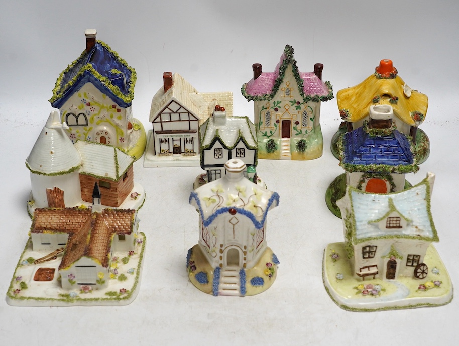 Ten various ceramic model cottages. Condition - fair to good